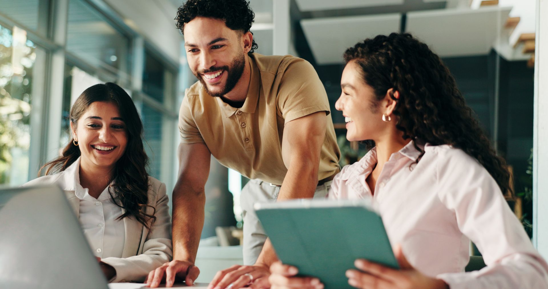 Laughing, meeting and colleagues with tablet, collaboration and humor for project, group and office. Happy, marketing coordinator and people with tech for campaign, teamwork and employees with jokes.