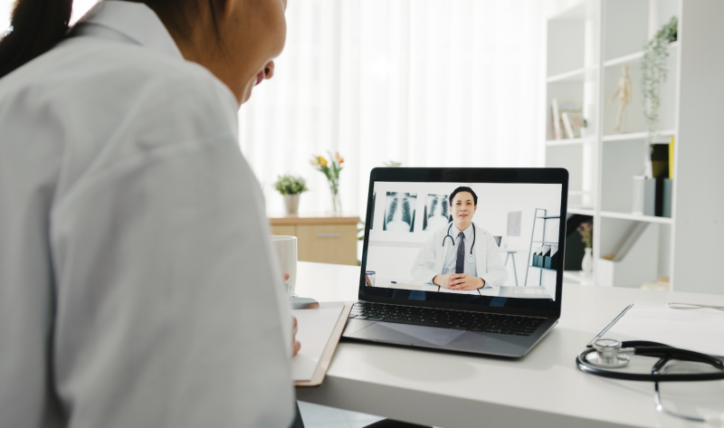 Clinician in a virtual call learning online