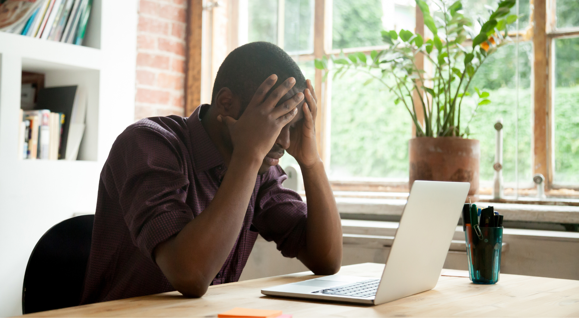 man frustrated with a data migration on his laptop